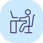Home office icon with person at desk in blue