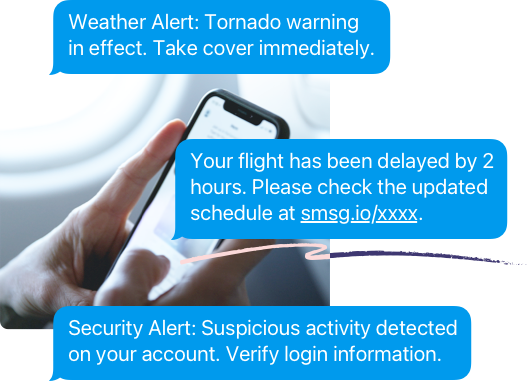 Hands texting on a mobile with three SMS alert examples